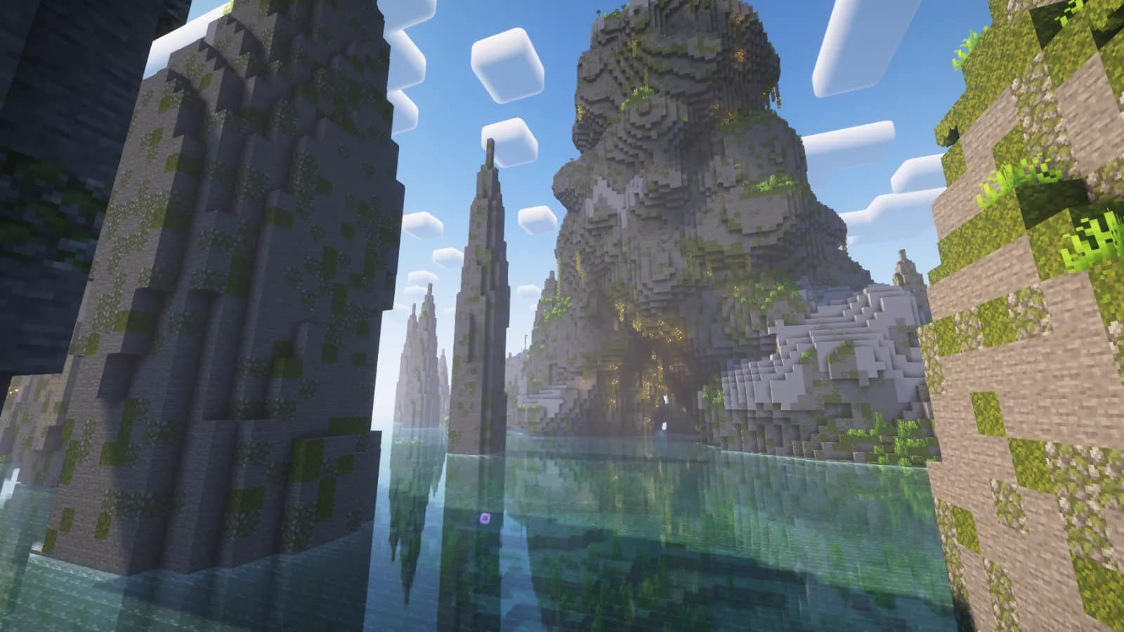 Mossy stone pillars rising out of a lake in a Minecraft world