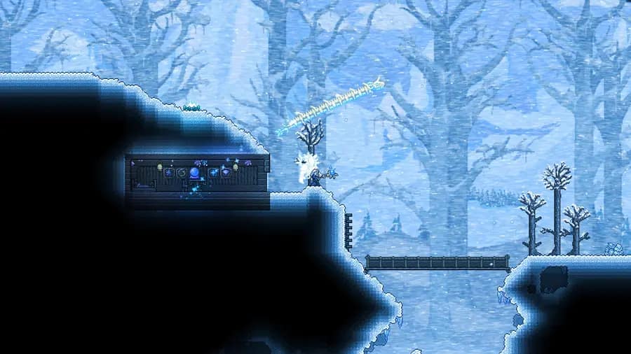 A player casting a frost spell from a snow-covered cliff, with a small house dug into the ice behind them