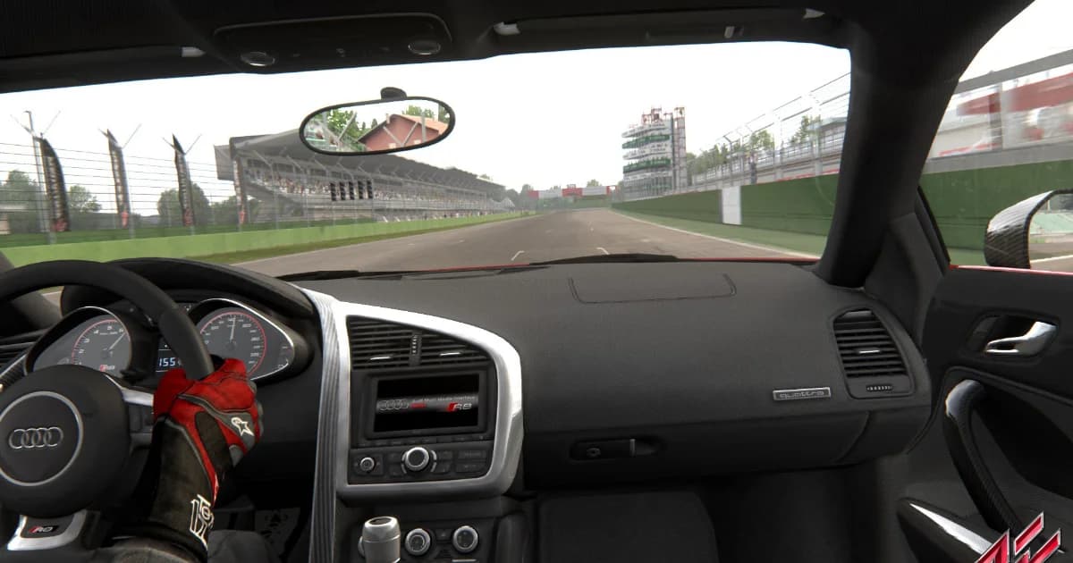 Cockpit view of an Assetto Corsa car dashboard and steering wheel