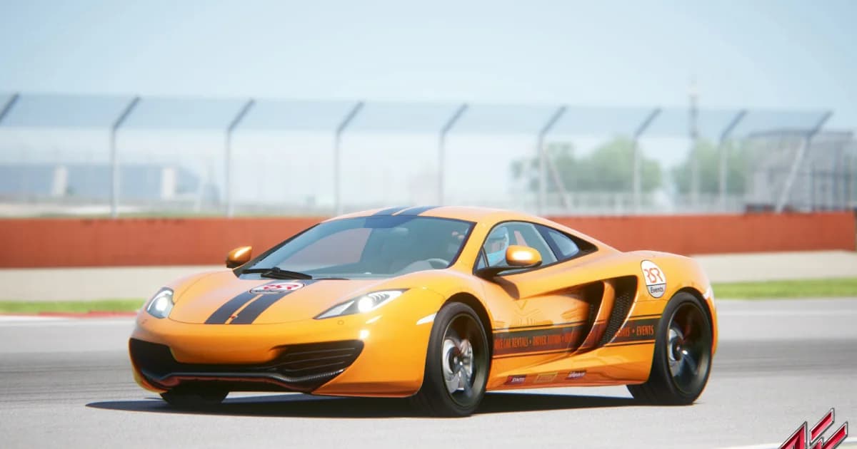 An orange McLaren MP4-12C on a race circuit in Assetto Corsa