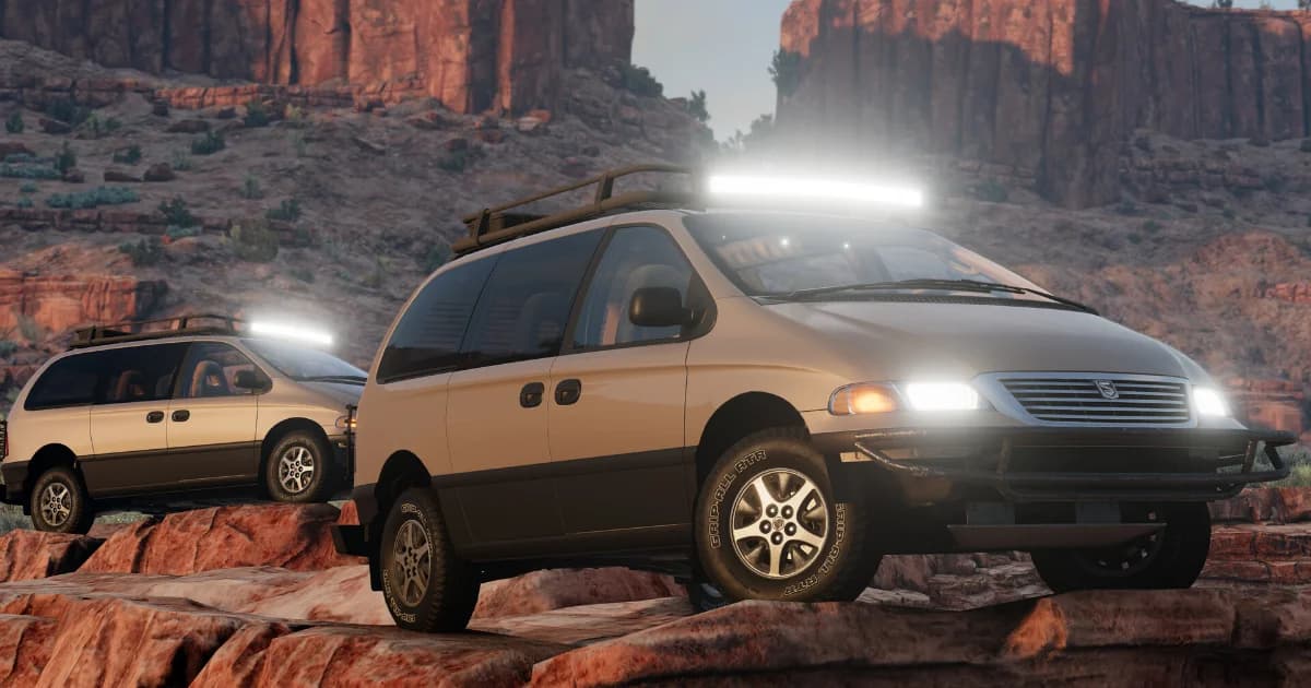 Vehicles parked in a red rock canyon map in BeamNG.drive