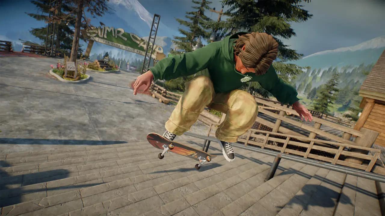 A skater kickflipping down a set of stone stairs beside a handrail
