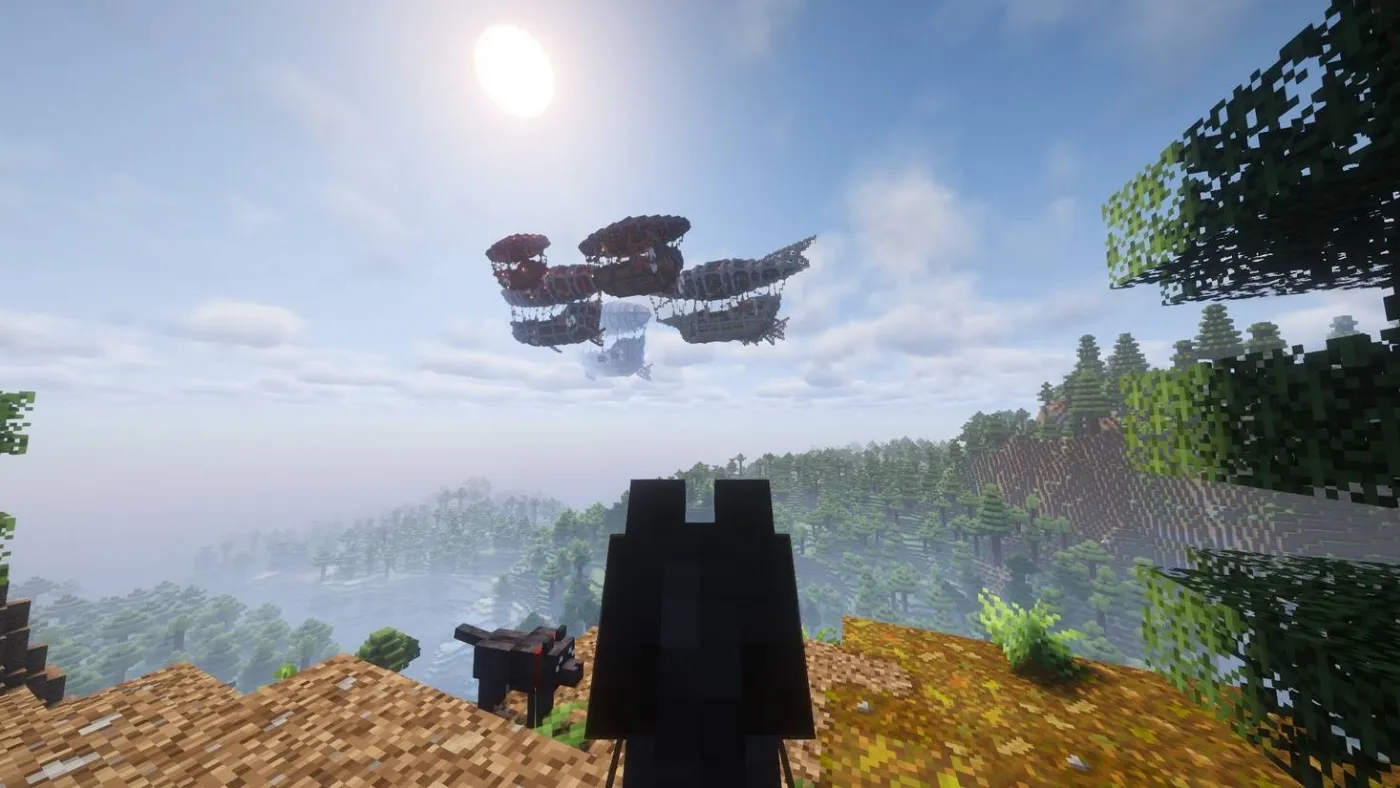 A player on a hilltop watching a fleet of Create airships drift over a forest and lake