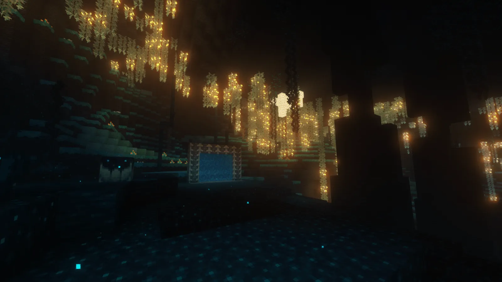 A dark Beyond Depth cavern strung with glowing golden vines around a blue portal frame