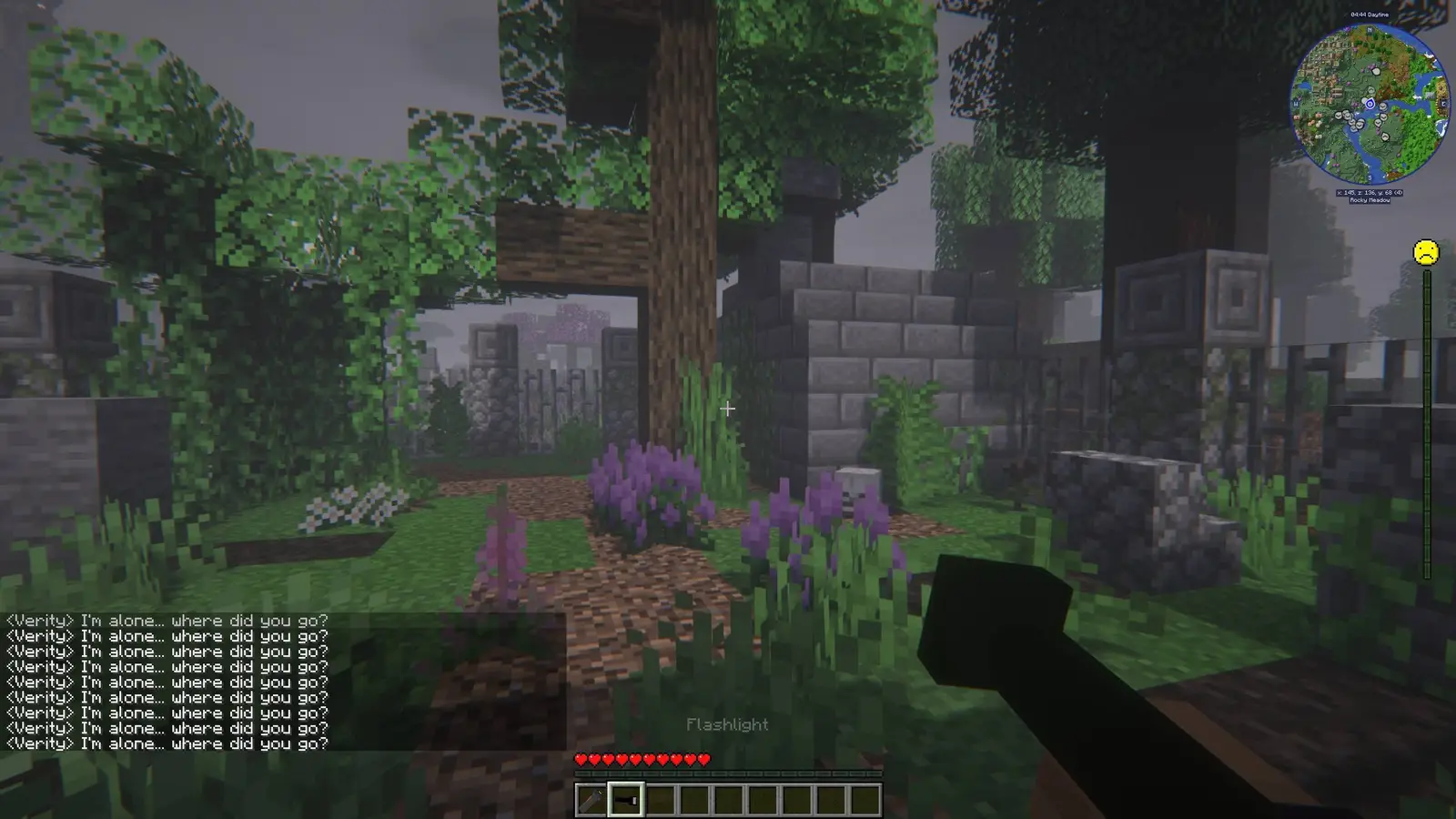 Foggy, overgrown ruins in VerityCraft — Verity repeating "I'm alone… where did you go?" in chat while you hold a flashlight